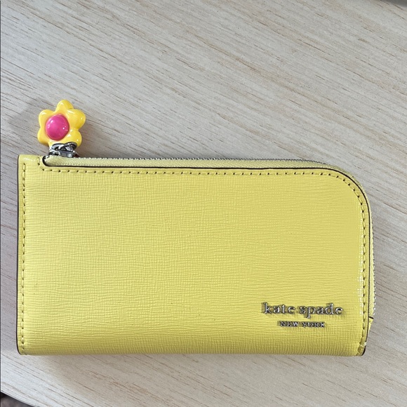 kate spade Handbags - Kate Spade Devin Small Slim Bifold Wallet in yellow - excellent condition